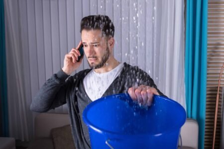 Guy calling SuperClean Restoration Service for water damage